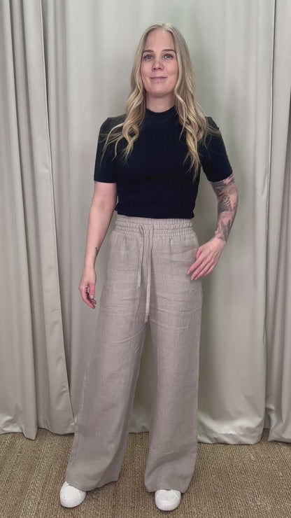 Leuto pellavahousut hiekka esittelyvideo